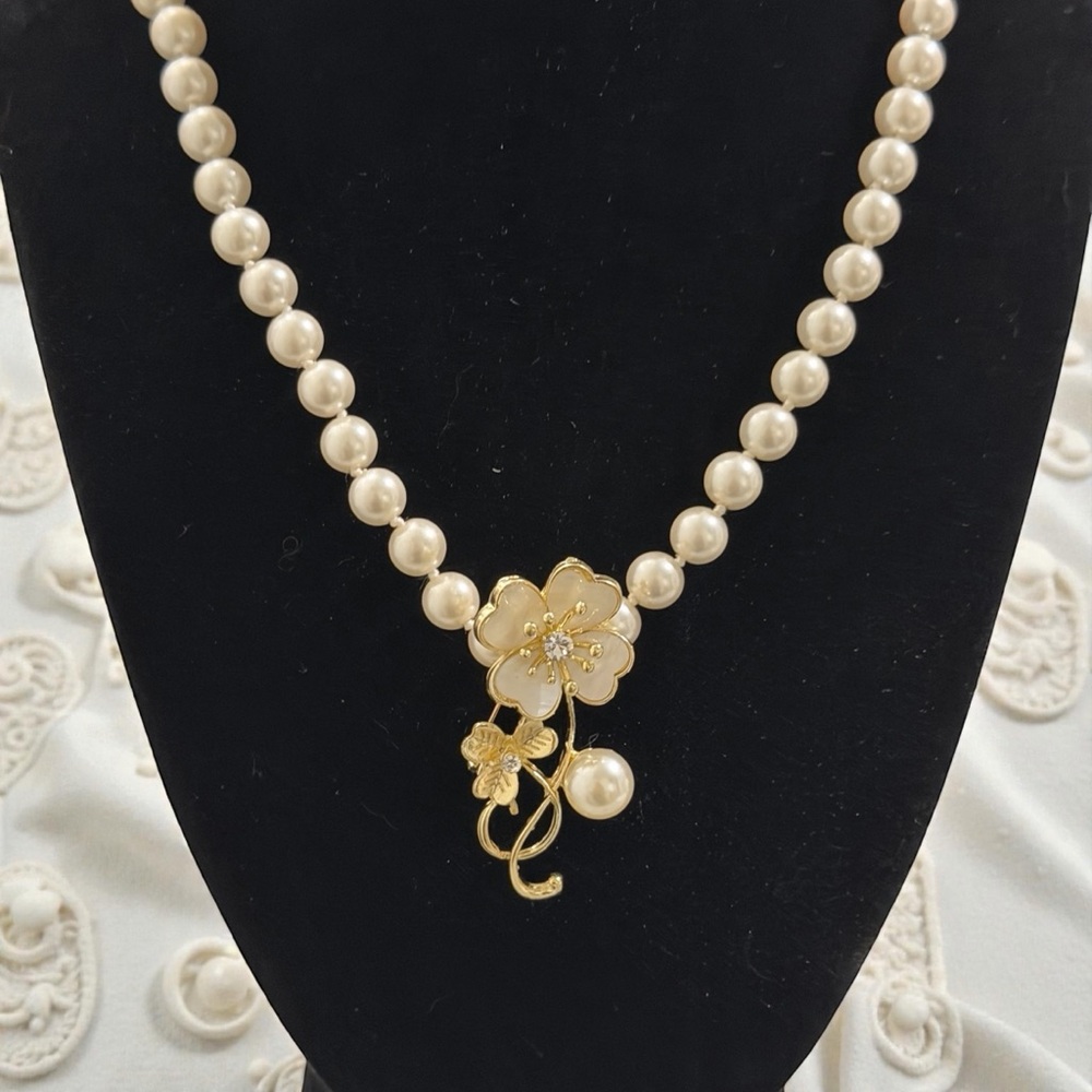 Elegant Pearl Necklace with Gold Floral Accent